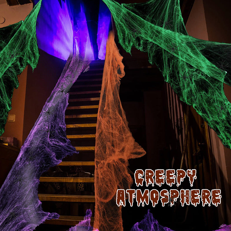 Decorative Halloween spider web with artificial spiders