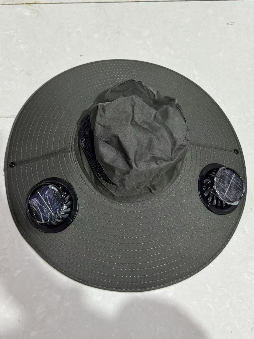 Ventilated sun hat with integrated battery fans, breathable mesh inserts, and adjustable chin strap Kalsten