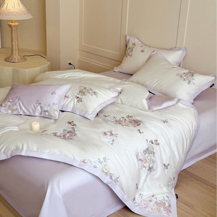 Finely embroidered bedding set with floral motifs and animal appliqués