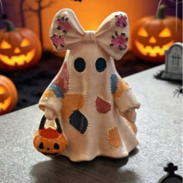 Ceramic ghost figure with integrated lighting and pumpkin basket