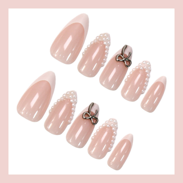 Glamorous artificial nail set with elegant bows and glitter accents Kalsten