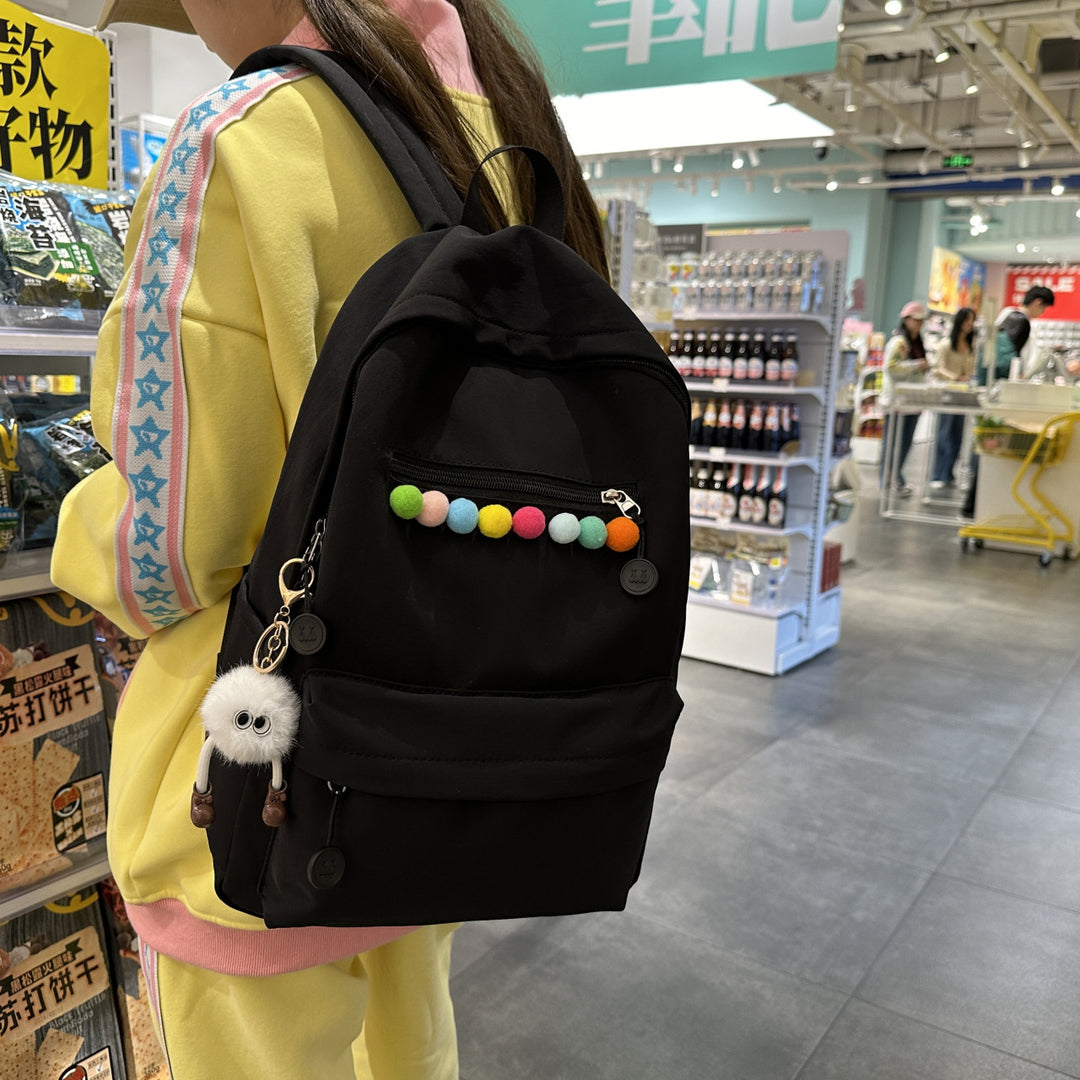 Practical backpack with colorful applications Kalsten