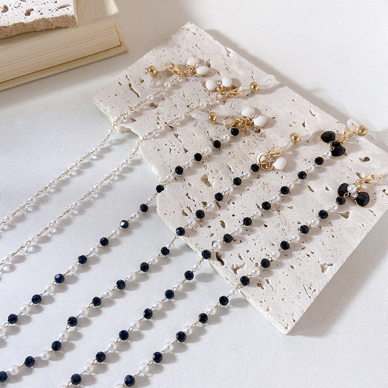 Elegant earrings with pearls and flower pendants Kalsten