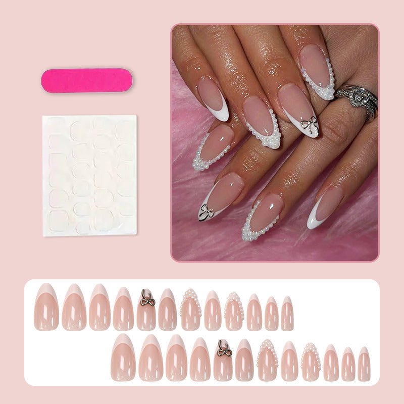 Glamorous artificial nail set with elegant bows and glitter accents Kalsten