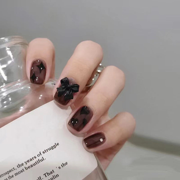 Artificial nails with elegant ribbon and heart designs Kalsten