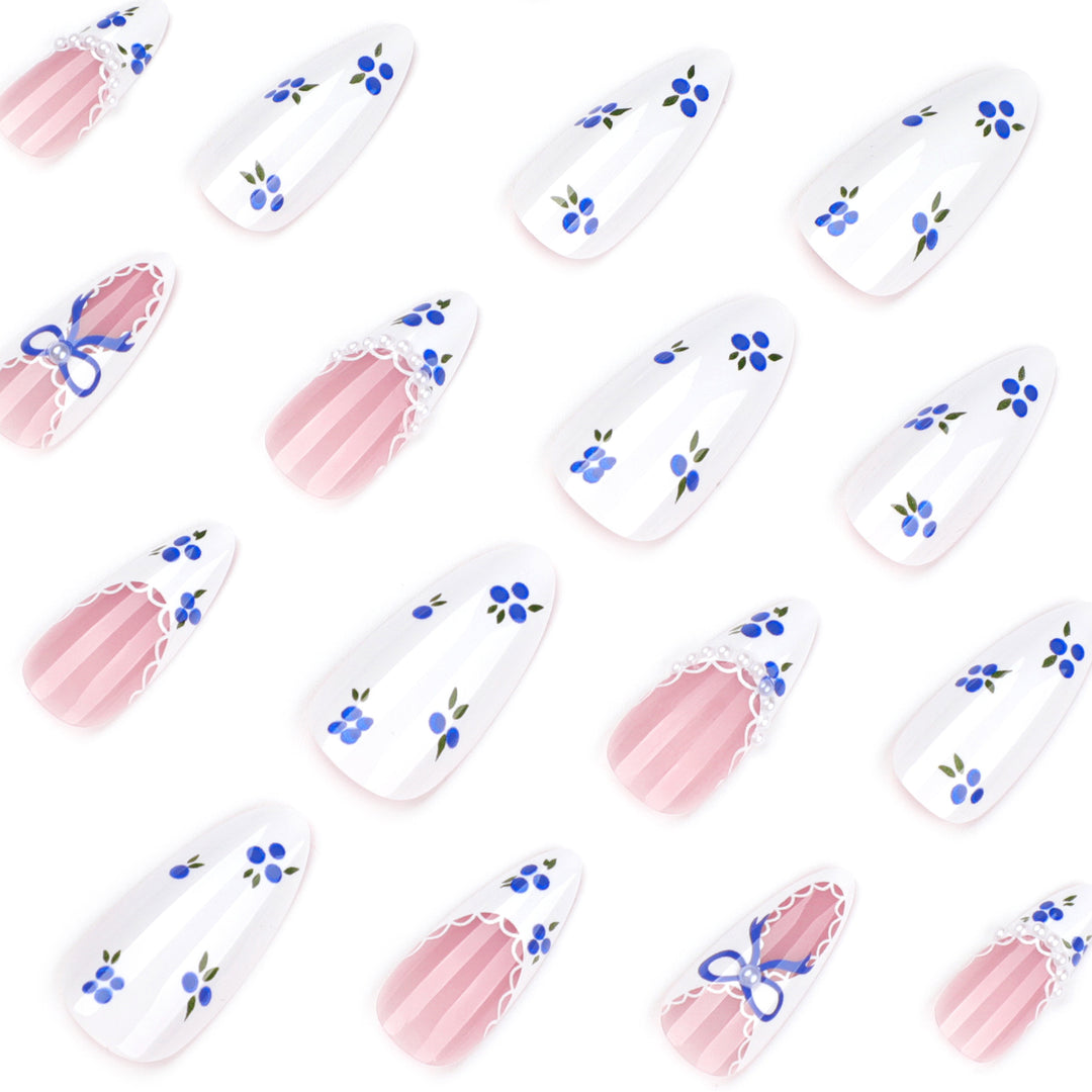 Artful nail art with floral accents and bow embellishment Kalsten
