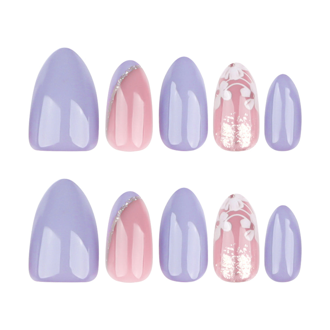Artistic nail art with floral accents and glitter kalsten