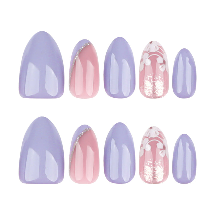 Artistic nail art with floral accents and glitter kalsten