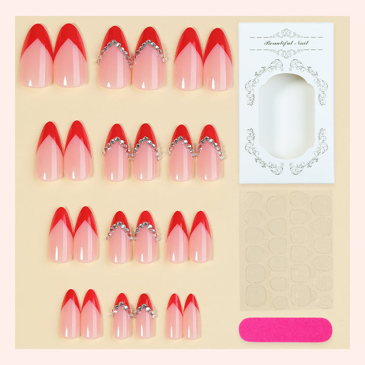 Nail art set with elegant red accents and rhinestone embellishments Kalsten