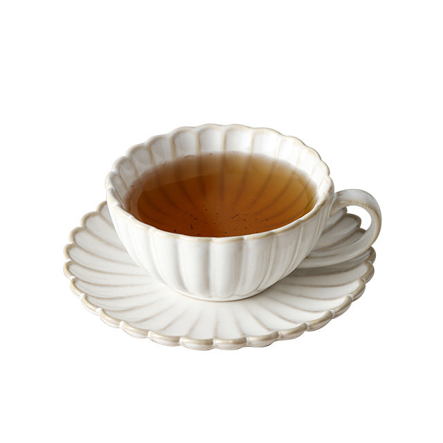 Fine porcelain tea cup set with ribbed shell edge and sculptural handle