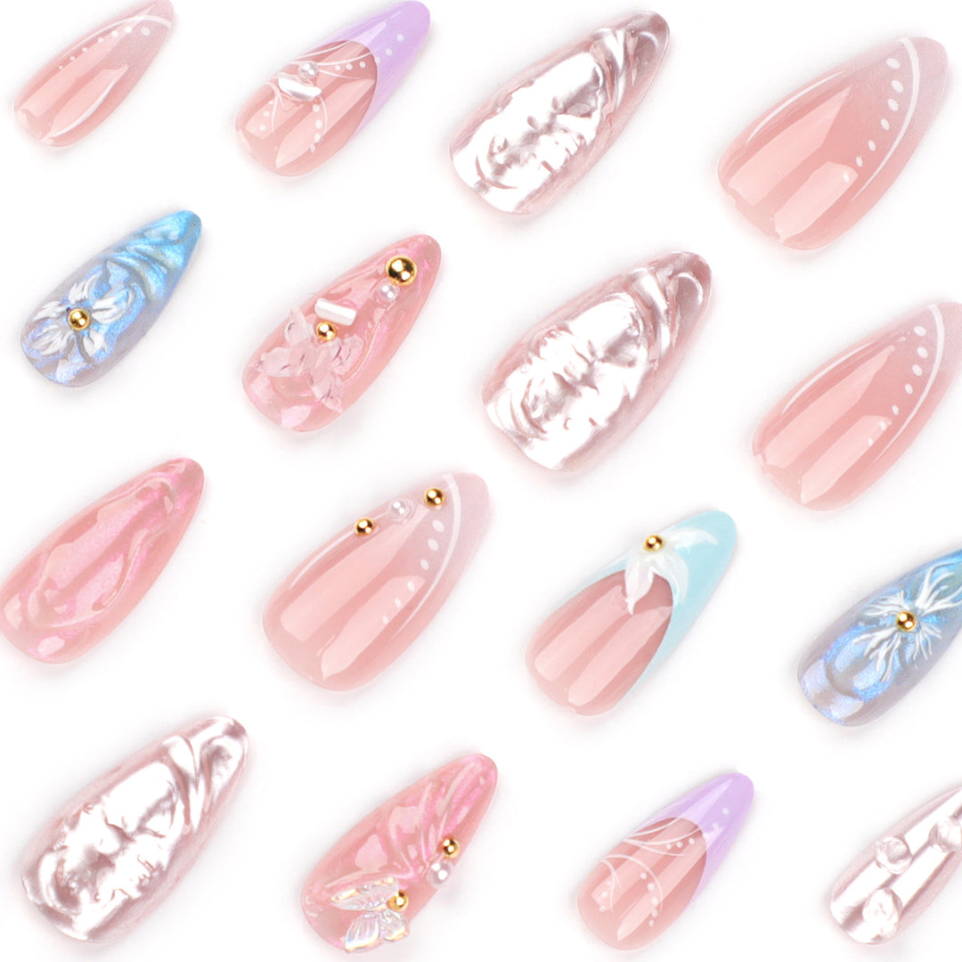 Artistic stiletto nails with delicate flower and glitter embellishments Kalsten