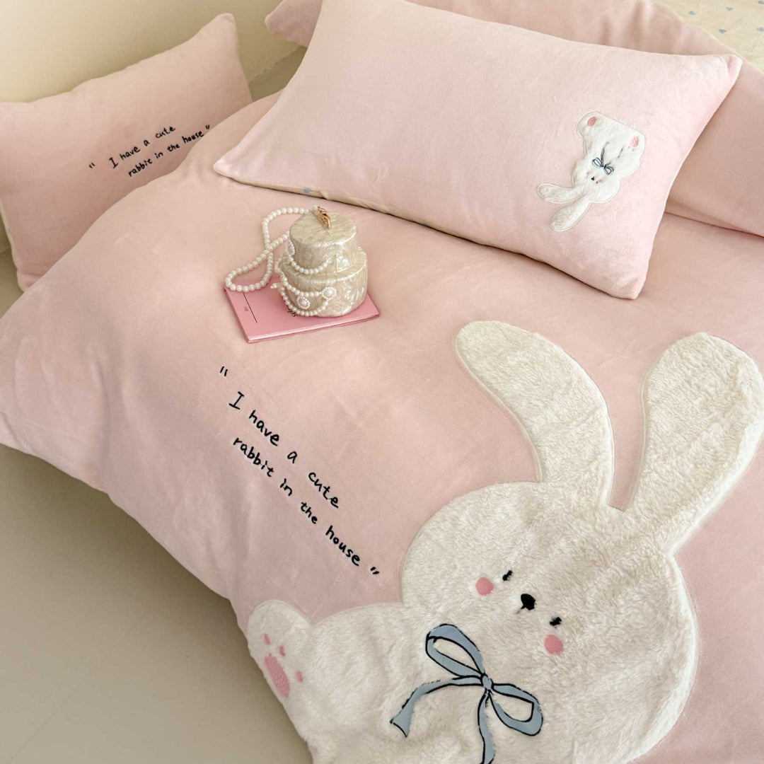 Cozy bedding set with embroidered rabbit appliqué and reversible cover