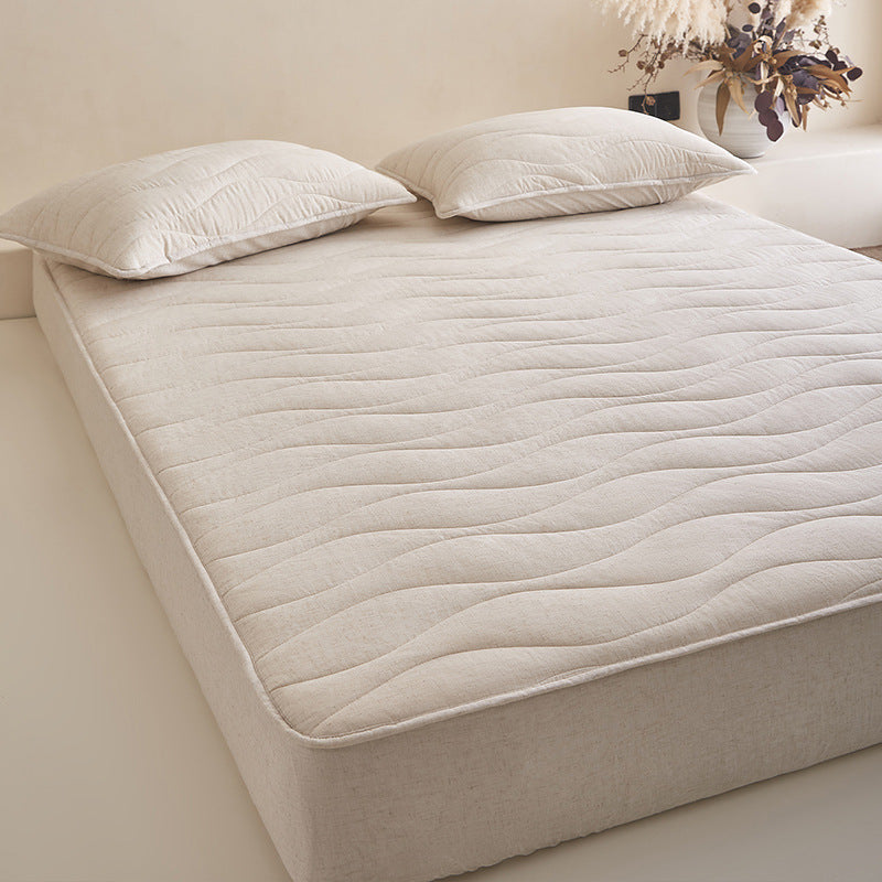 Quilted mattress topper with all-around fitted edge and breathable padding