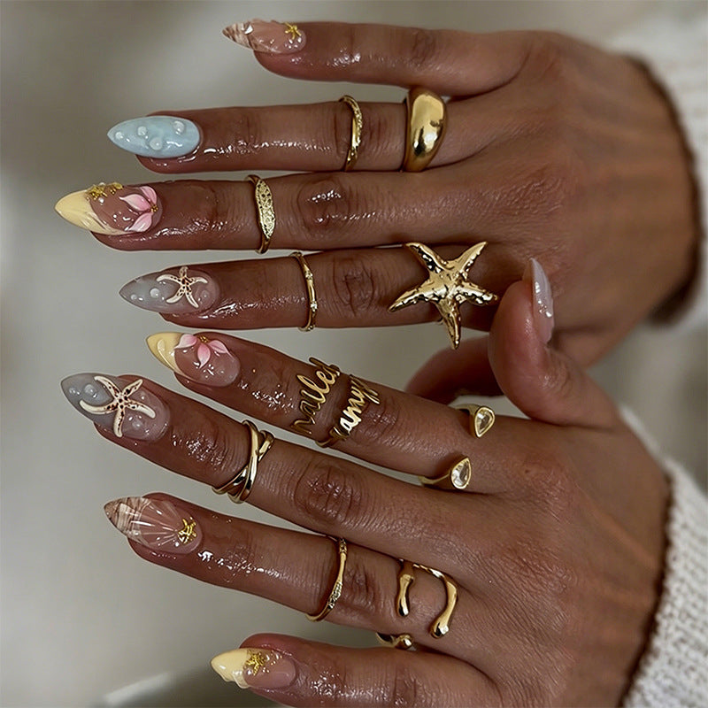 Artificial nail set with floral motifs and glitter accents Kalsten