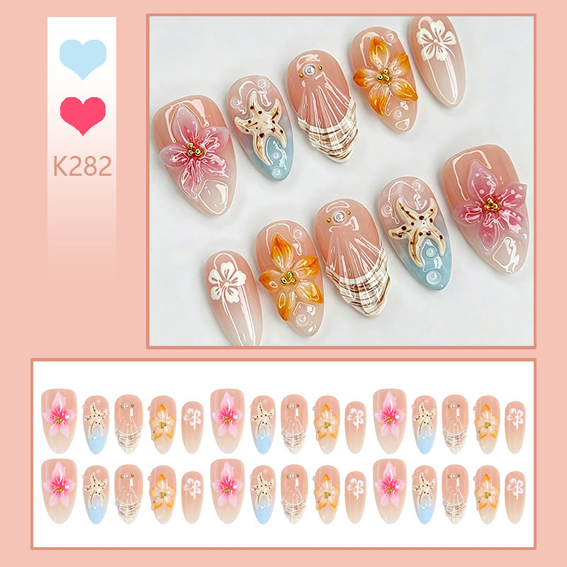 Artificial nail set with filigree flower and glitter details Kalsten