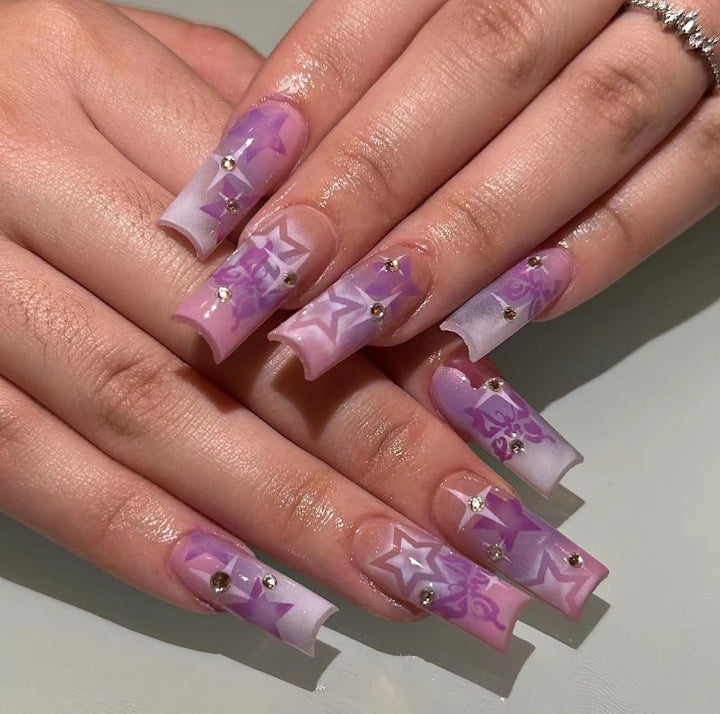 Artistic acrylic nails with modern glitter accents Kalsten