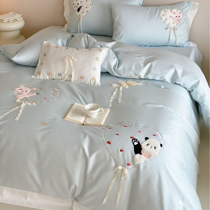 Romantic cotton bedding set with appliquéd heart balloons and plush motifs