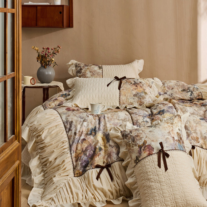 Romantic bedding set with frill, quilted panels and floral watercolor look