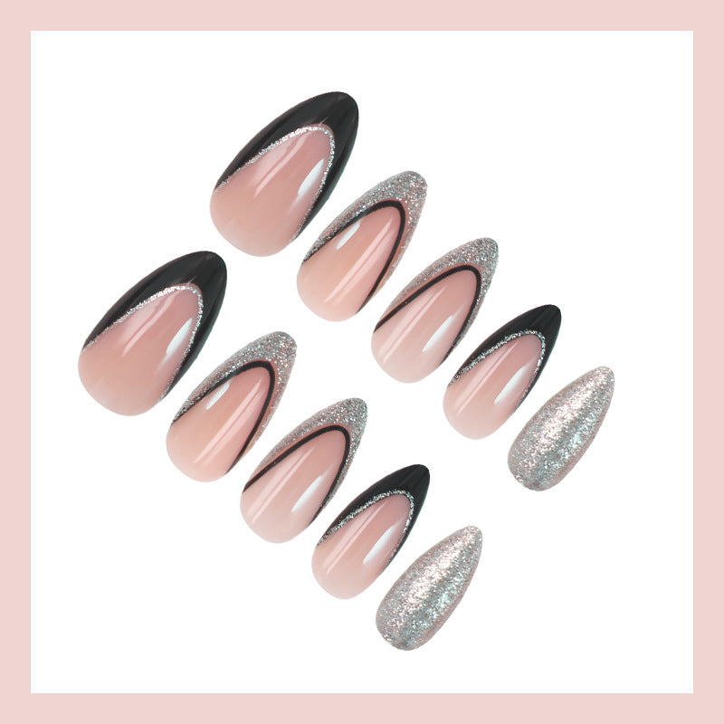 Artificial nail set with glamorous glitter accents and elegant black Kalsten