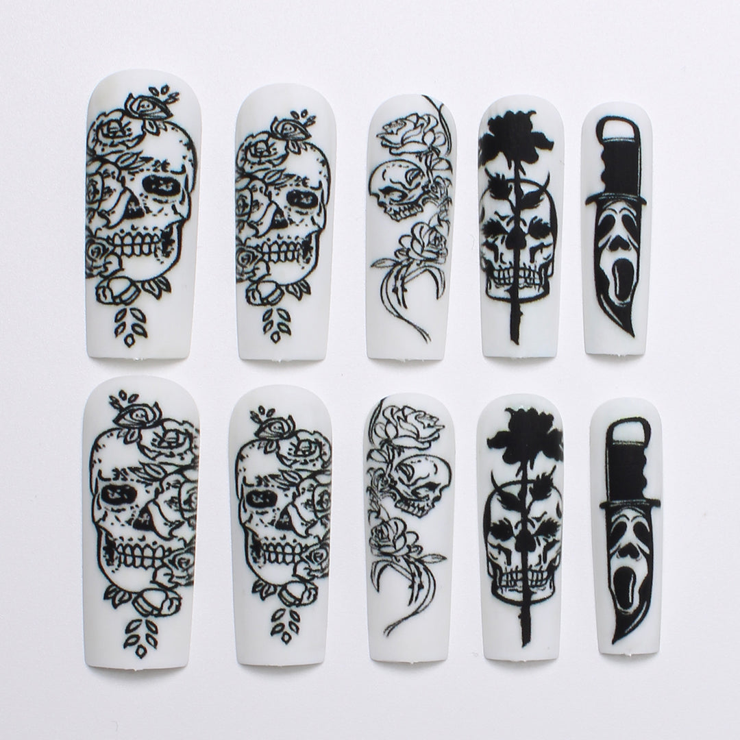 Nail set with spooky skull design and floral motifs Kalsten