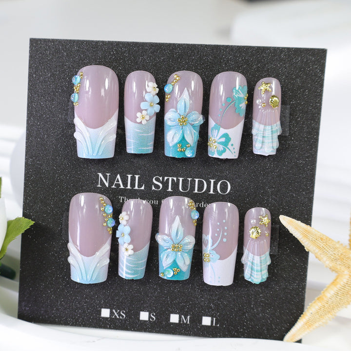 Acrylic nail set with elegant floral decorations and glitter accents Kalsten