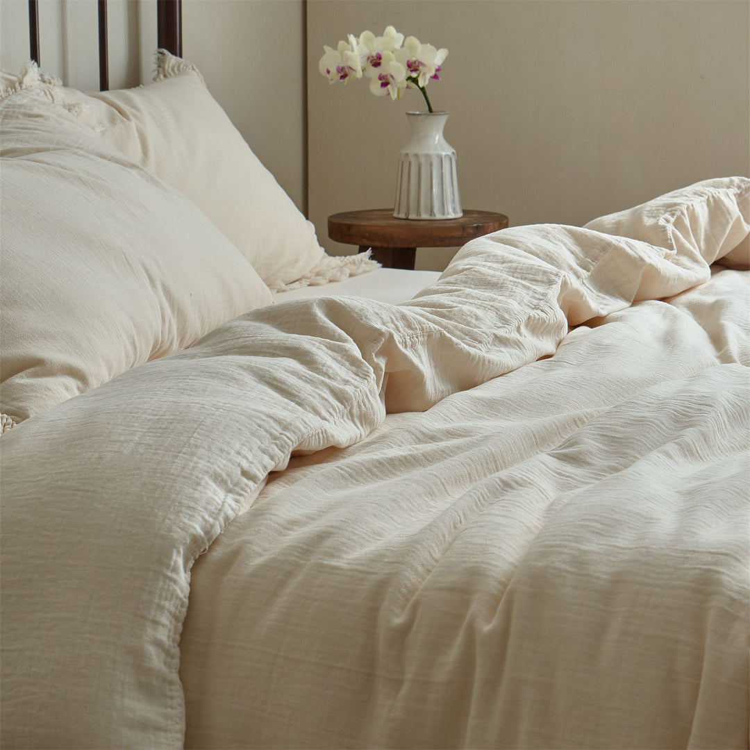 Washed linen bedding set with fringe trim and natural texture