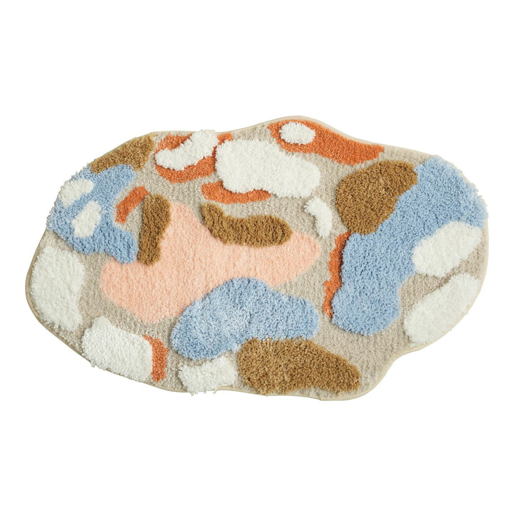 High-pile bath mat with non-slip backing and abstract structural pattern