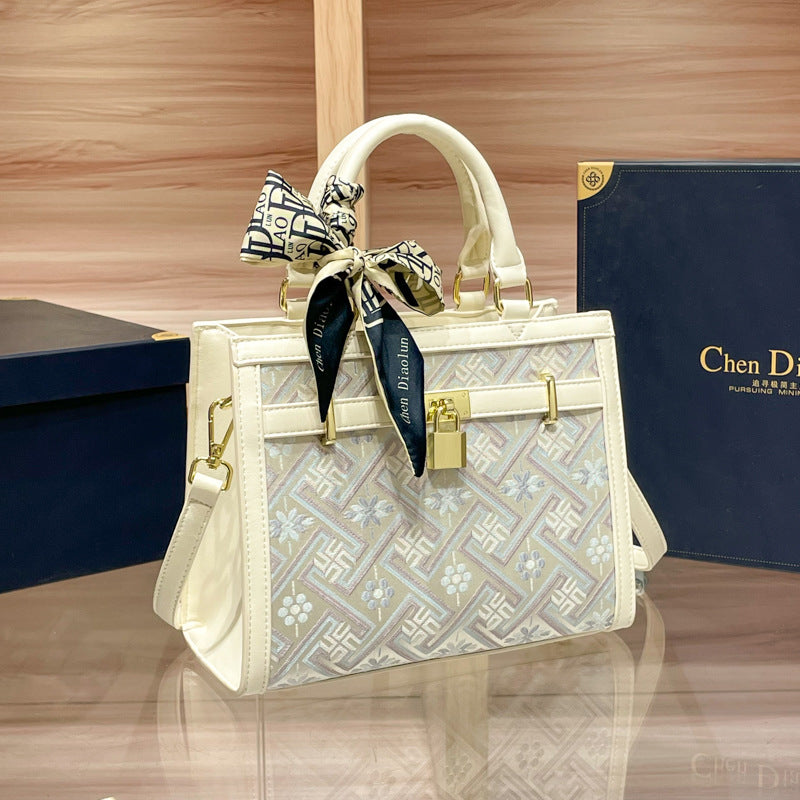 Elegant Designer Handbag with Decorative Bow