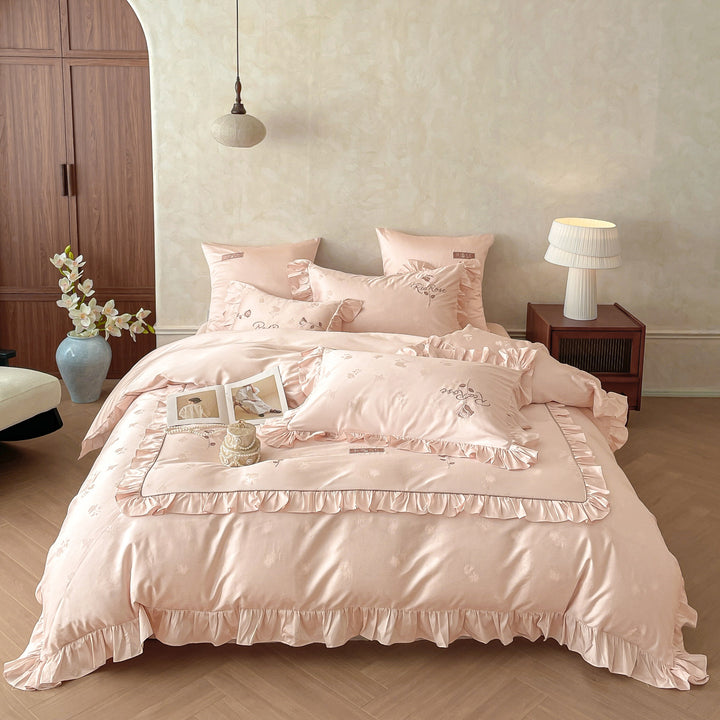 Romantic satin bedding set with ruffles, fine floral embroidery, and reversible pillowcase