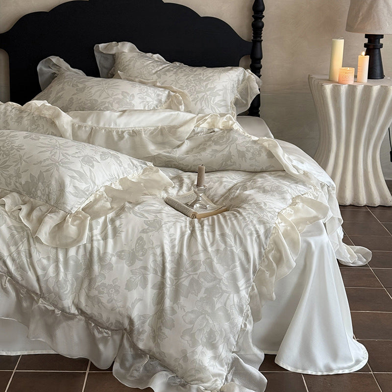 Elegant bedding set made of fine satin jacquard with delicate floral relief and decorative ruffle