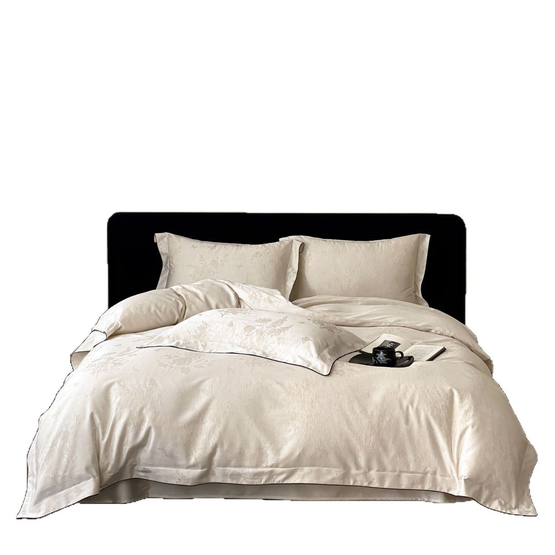 Finely woven cotton percale bedding set with subtle jacquard structure and contrast piping