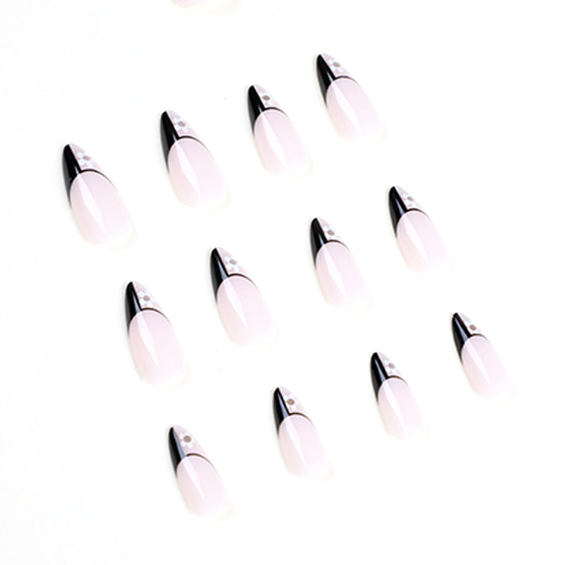 Artful nail art with elegant black-and-white design and floral accents Kalsten