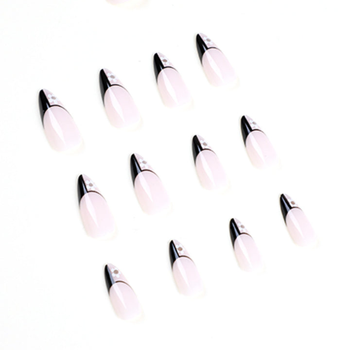 Artful nail art with elegant black-and-white design and floral accents Kalsten