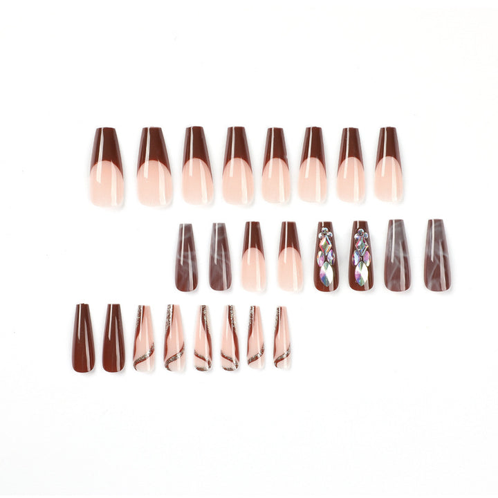 Artificial nail extensions with elegant gemstone embellishments Kalsten