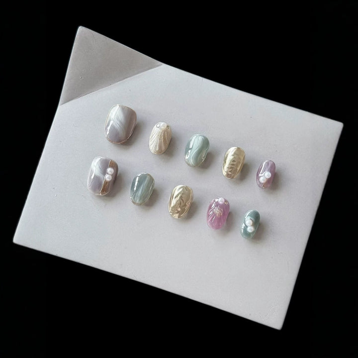Artistic Press-On Nail Set with Pearl and Marble Accents