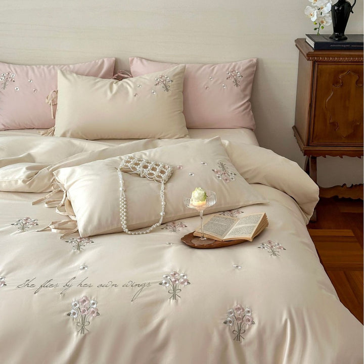 Luxurious satin bedding set with delicate pearl flower embroidery and tie ribbons