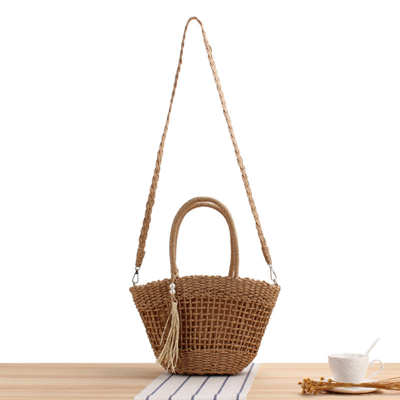 Handbag made of braided natural material with elegant tassel decoration Kalsten
