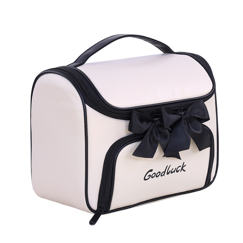 Cosmetic and toiletry bag with elegant bow accent Kalsten