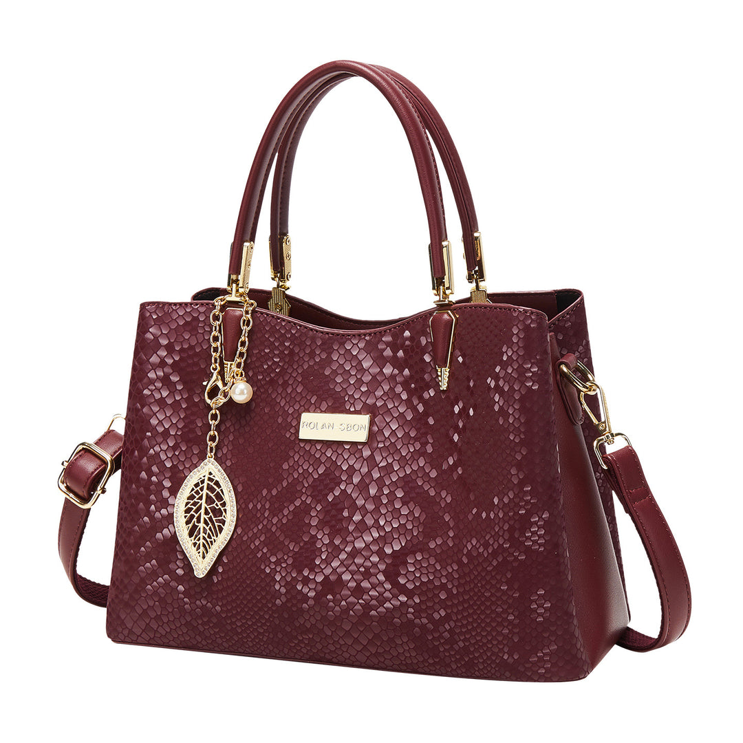 Elegant Designer Handbag with Decorative Charm