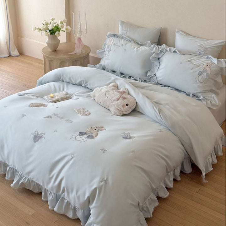 Satin bedding set with ruffles, embroidered bunny appliqués and silky-smooth finish