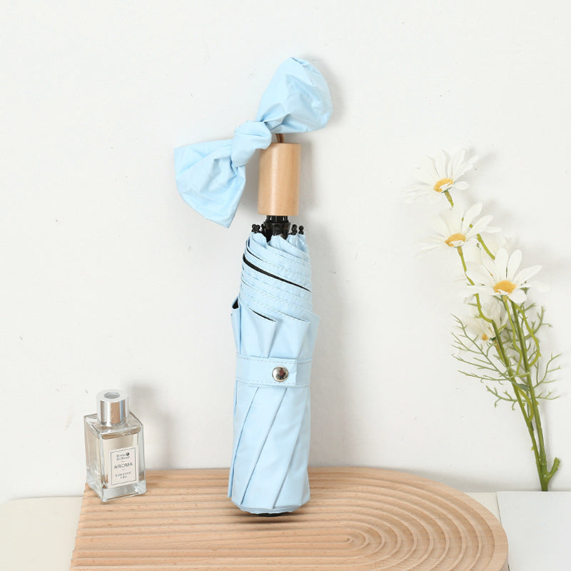 Ladies compact folding umbrella with elegant design and ergonomic wooden handle Kalsten