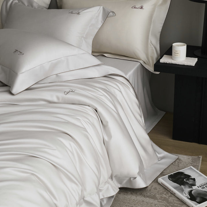 Bedding set made of fine satin with a silky-smooth finish and embroidered logo
