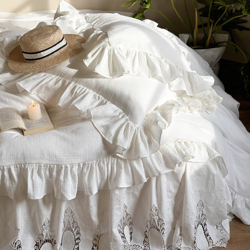 Romantic bedding set with voluminous ruffle, lace bed skirt, and double-layered frills