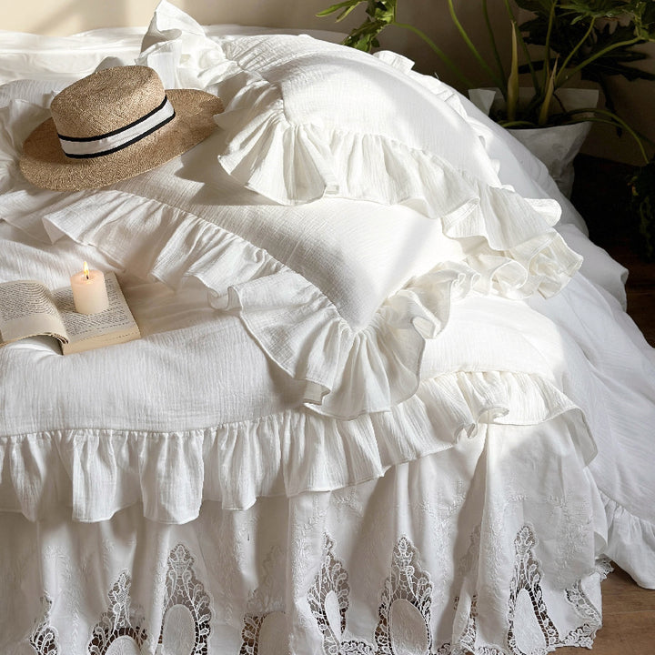 Romantic bedding set with voluminous ruffle, lace bed skirt, and double-layered frills
