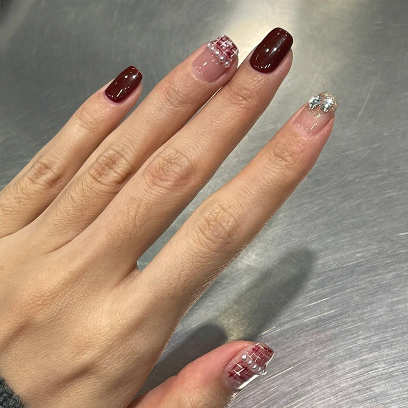 Elegant Press-On Nail Design with Glitter and Gemstone Accents Kalsten