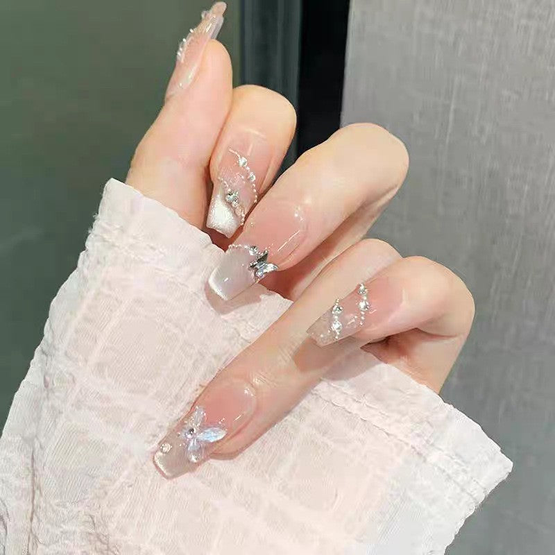 Artificial nails with glamorous decorations and shine Kalsten
