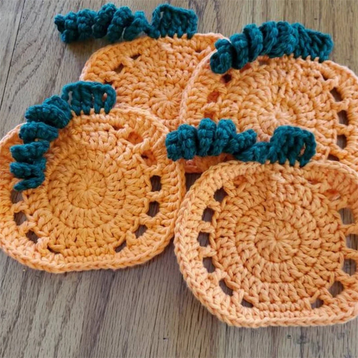 Hand-crocheted pumpkin pot holder and table mat made of cotton yarn