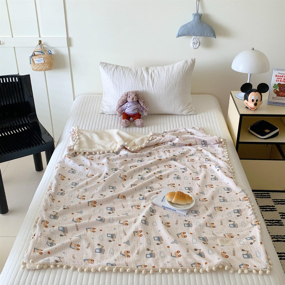 Children's Wende cuddly blanket made of cotton muslin with pompom border