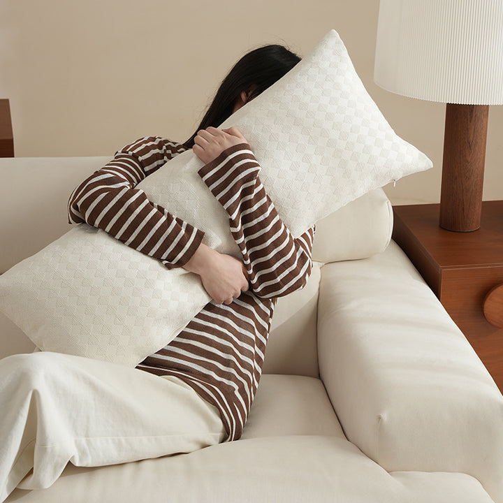 Long decorative lumbar roll made of textured linen fabric