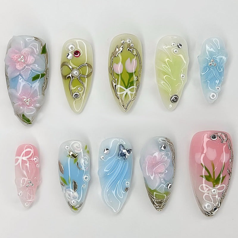 Creative nail set with hand-drawn floral patterns and glitter accents Kalsten